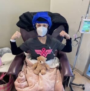 Valeria wearing a Penguin Cold Cap during chemotherapy to help reduce hair loss.