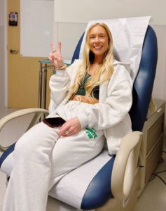 Tanner smiling in the treatment chair before chemotherapy.
