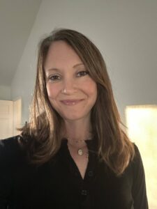 Erin smiling after chemotherapy with most of her hair preserved using Penguin Cold Caps