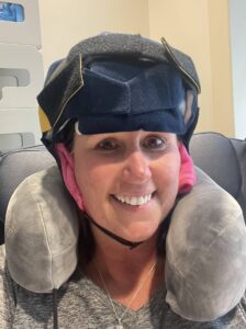 Heather Baker smiling while wearing Penguin Cold Caps during chemotherapy